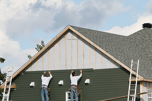 Professional Siding Installation technician working in Madison, PA
